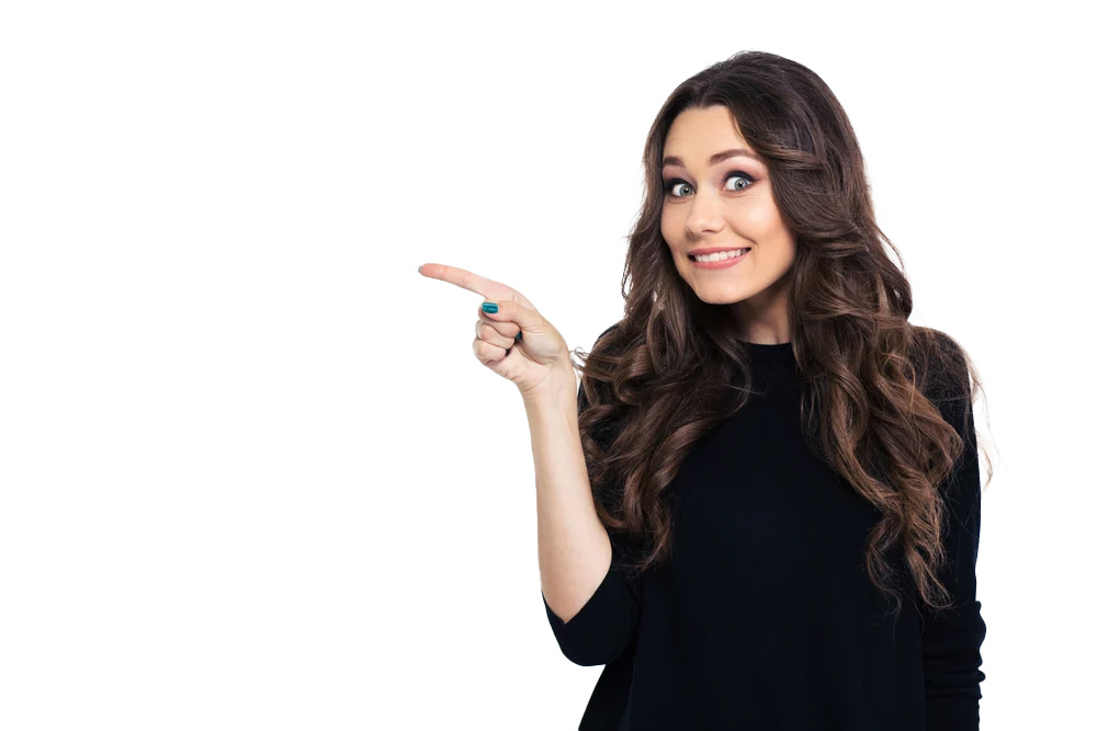 Portrait of a smiling girl pointing finger away isolated on a white background